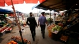 Russia -- Police officers walk through a market during a spot check of street markets and cafes in the Siberian city of Krasnoyarsk, August 7, 2013